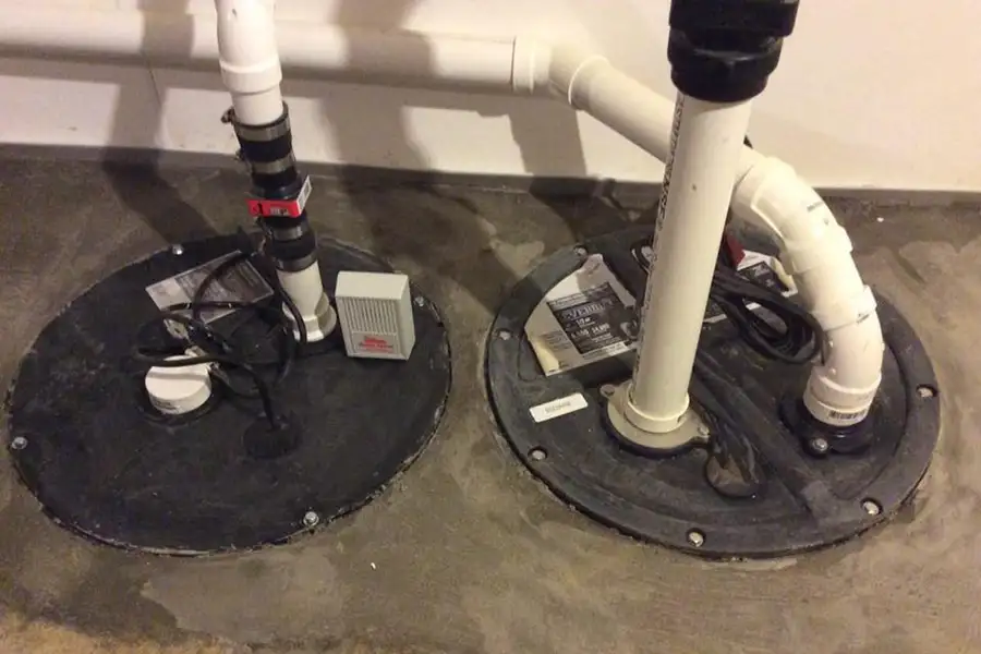 Lovell Basement Solutions, LLC basement sump pump and basin installed and protected from water damage - Edwardsville, IL